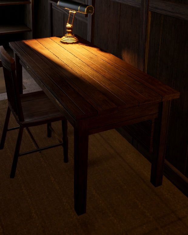 A desk lamp, and the short distance its light reaches.